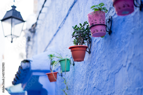 Moroccan pottery has different colors blue wall © Lara