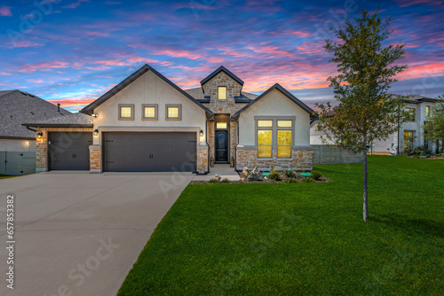 a house with windows and a driveway  photo