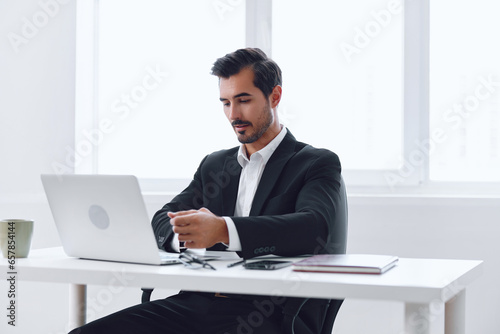 Man desk laptop office worker computer working suit businessman sitting tired business © SHOTPRIME STUDIO