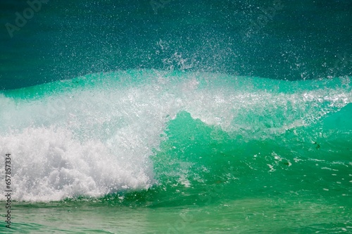 Waihi, New Zealand; A Breaking Wave Creating A Splash photo