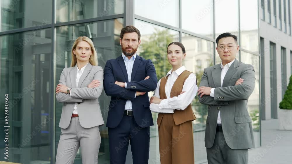 Group of successful confident employees co-workers near office or campus building. outside outdoors. Portrait team of business or tutor teachers people man and woman in formal suits looking at camera Group of successful confident employees co-workers near office or campus building. outside outdoors. Portrait team of business or tutor teachers people man and woman in formal suits looking at camera