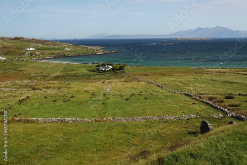 Green Fields And Stone Walls On Inishbofin Island Off The Coast In Connacht Region; County Galway, Ireland photo