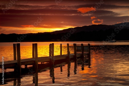 Sunset Over Dock At Lake Windermere; Ambleside, Cumbria, England photo