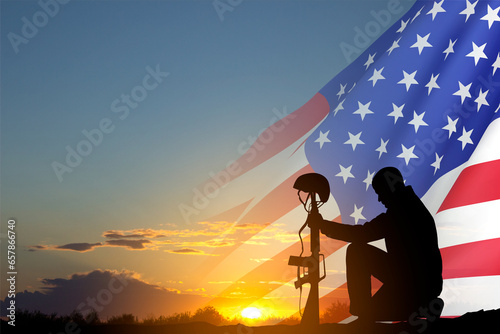 Silhouette of soldier with USA flag against the sunset. Greeting card for Veterans Day, Memorial Day, Independence Day © ecrow
