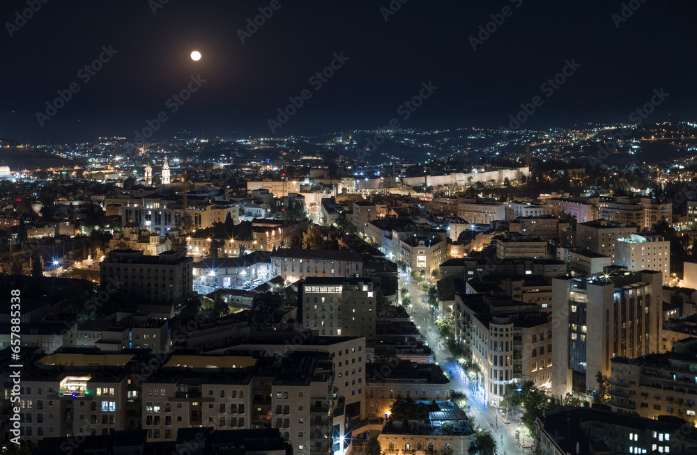 Obraz premium Night Jerusalem aerial view. Jaffa street, moon