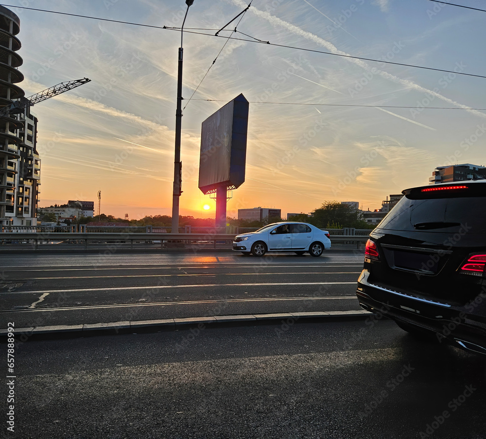 Road with traffic at sunset