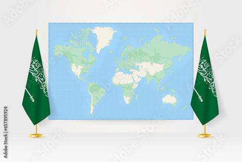 World Map between two hanging flags of Saudi Arabia flag stand.