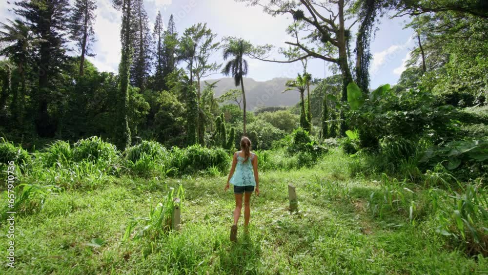 Woman Walking Through Hawaiian Forest In Slow Motion Woman Walking Through Hawaiian Forest In Slow Motion