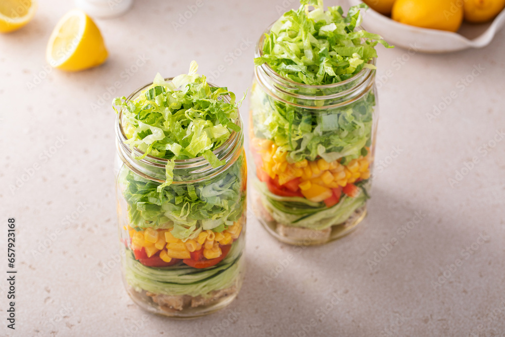 Chicken and vegetable salad in a jar, meal prep for healthy lunch on the go