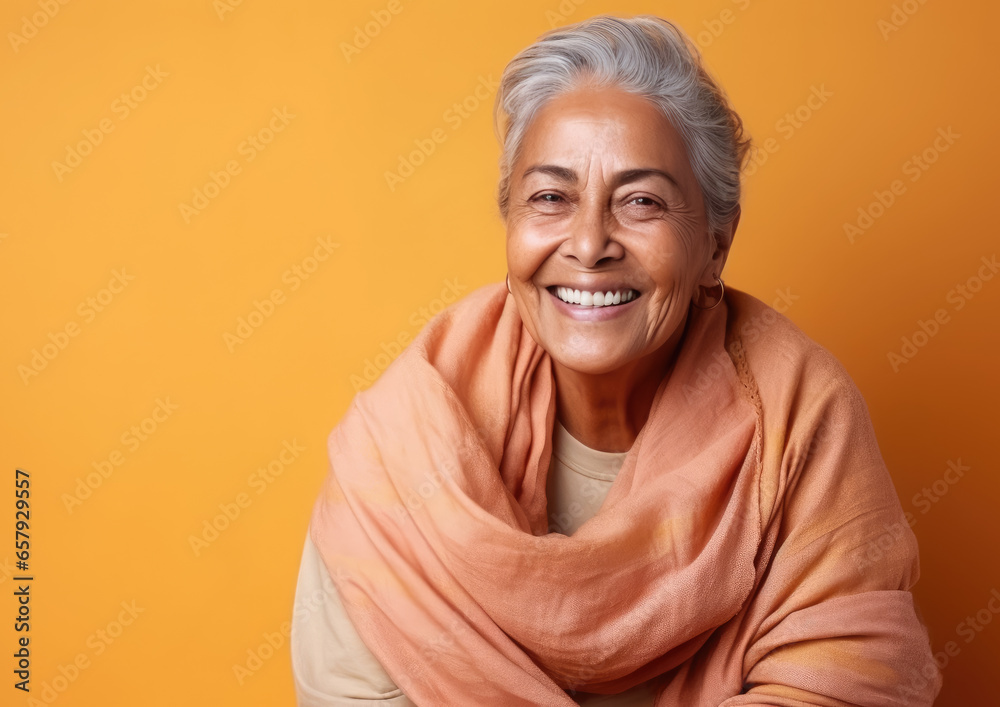 Generative AI, joyful elderly indian woman in casual stylish clothes smiling on color background, advanced age, old lady, space for text, mature people, happy pensioner, retired lifestyle Generative AI, joyful elderly indian woman in casual stylish clothes smiling on color background, advanced age, old lady, space for text, mature people, happy pensioner, retired lifestyle