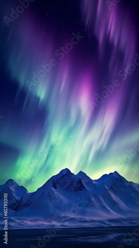 An aurora bore is seen in the sky above a mountain range