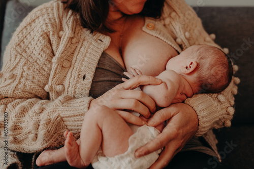 mother breastfeeding newborn