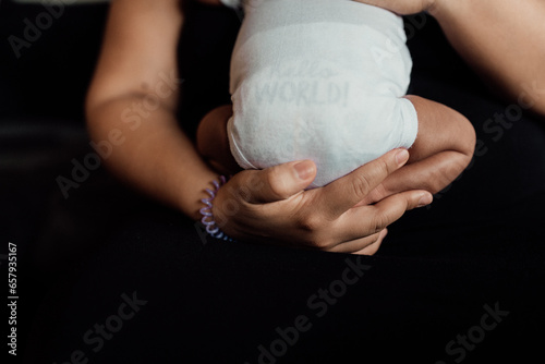 mother holding newborn