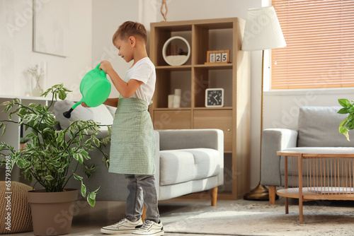 Cute little gardener wateri...