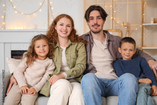 Happy family of four relaxi...