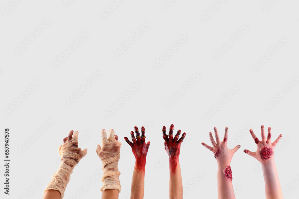 Zombie and mummy hands on white background. Halloween celebration Zombie and mummy hands on white background. Halloween celebration