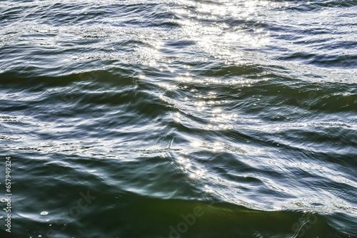 Fototapeta Naklejka Na Ścianę i Meble -  Glisten on blue waves