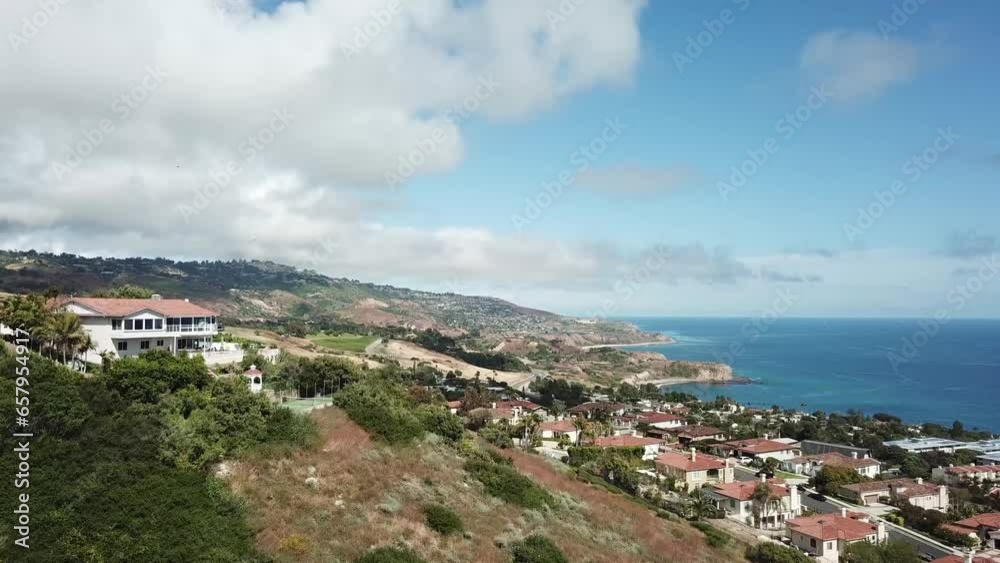 Palos Verdes California Aerial view houses on hills coast line overseeing the ocean beautiful homes tech blue sky water