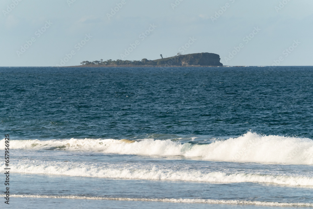 Alexandra Headland, Queensland, Australia - October 2nd, 2023. Mudjimba Island, as seen from Alexandra Beach.