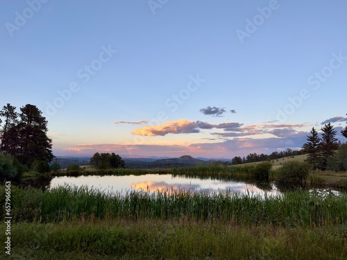 "Serenity at Sunset: The Mountain-Top Pond"