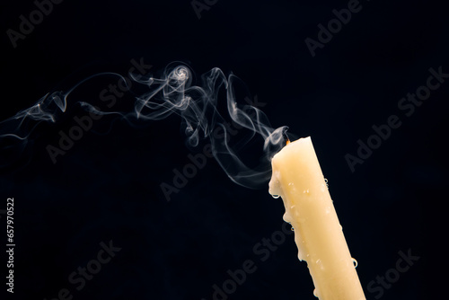 Photos Smoke from an extinguished candle on a dark background