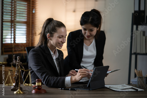 Lawyers Asiawoman   having through online Concepts  of Legal services at the law office. photo