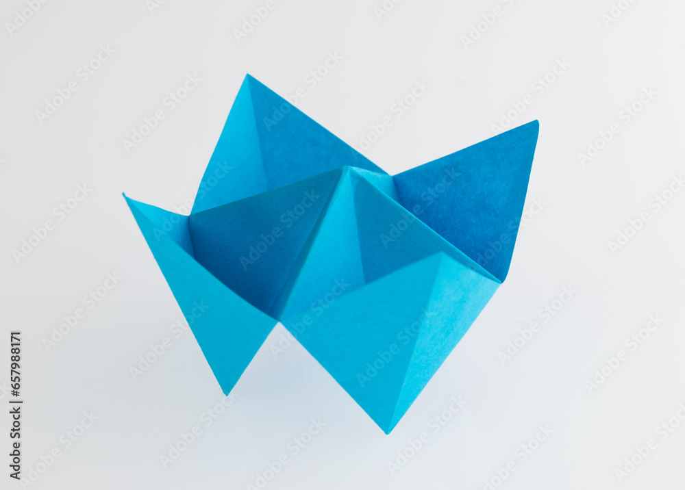 Origami paper fortune on white background Origami paper fortune on white background