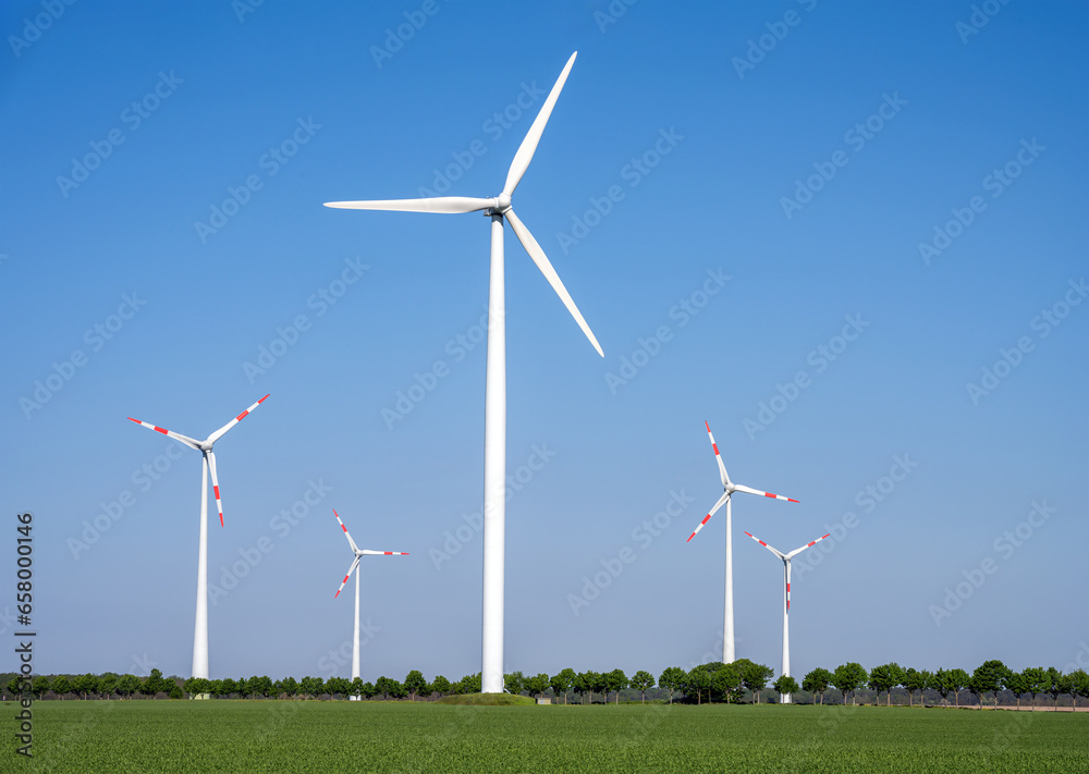 Modern wind turbines in a rural landscape with blue skies seen in Germany Modern wind turbines in a rural landscape with blue skies seen in Germany