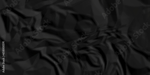 Crumpled paper texture. black crumpled paper texture. top view. crush paper so that it becomes creased and wrinkled. Old black crumpled paper sheet background texture.
