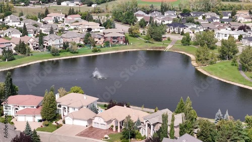 Aerial footage of Briarwood, Saskatoon, SK, highlighting its elegant homes, winding streets, and green parks. A tranquil suburban escape, perfect for real estate visuals. photo