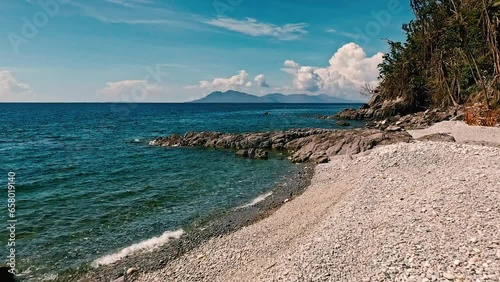 Looc Beach Over a Beach of Shingles on a Beautiful Summer's Day in the Philippines with an Aerial Drone.  photo