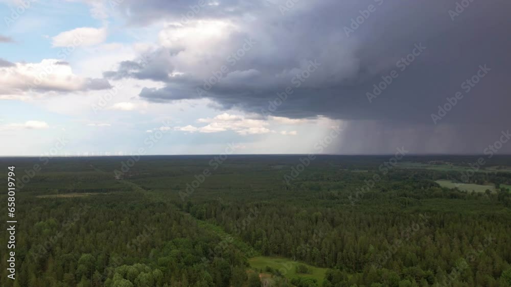 Timelapse, dark clouds and rain over coniferous forest Timelapse, dark clouds and rain over coniferous forest