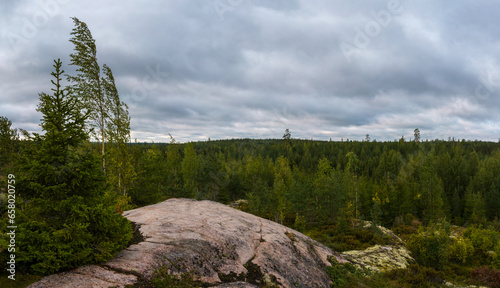 Landscape from top of a hill in Finland on a cloudy day photo