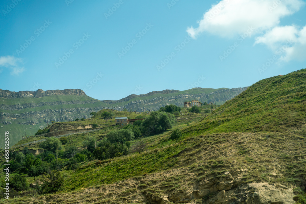 Village of Chokh in Dagestan. Facades of houses located in tiers on a steep slope, summer landscape.