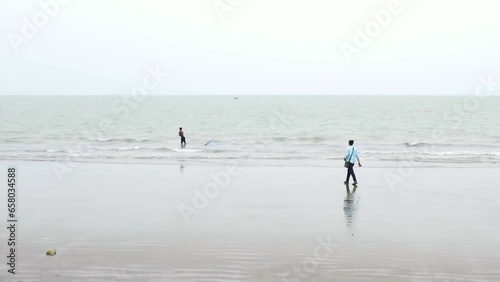 photographer, traditional net fishing, kuakata sea beach, bangladesh photo