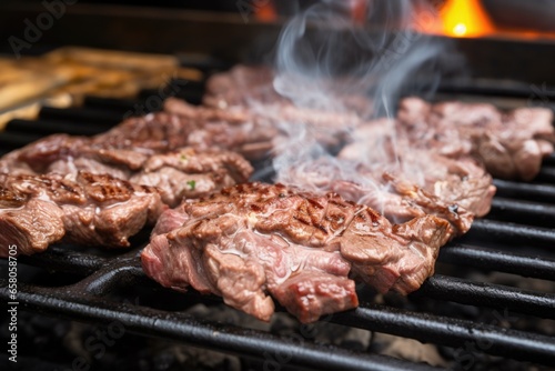 close up view of bulgogi beef grilling over charcoals