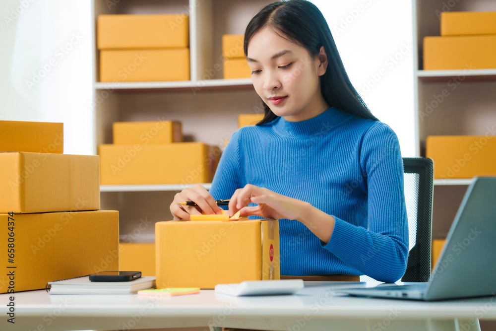 Asian woman people tackling warehouse tasks with dedication, realities of small web business management, e-commerce , dynamic world of small online business operations, efficient inventory management Asian woman people tackling warehouse tasks with dedication, realities of small web business management, e-commerce , dynamic world of small online business operations, efficient inventory management