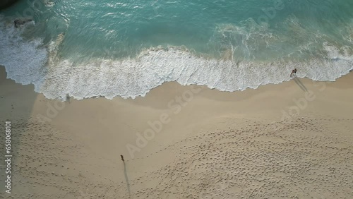 Aerial view of toursits on Kelingking Beach, Nusa Penida near Bali, Indonesia photo