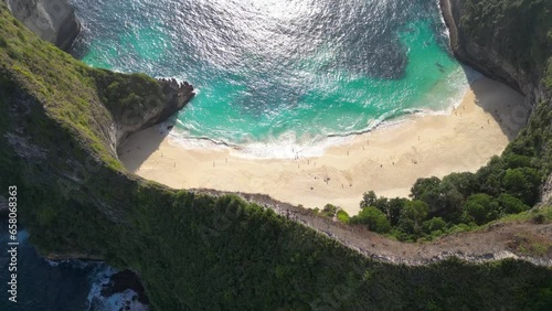 Drone shot of Kelingking Beach, Nusa Penida island near Bali, Indonesia photo