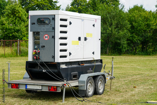 Connected large rental diesel generator on a mobile trailer for outdoor event power supply