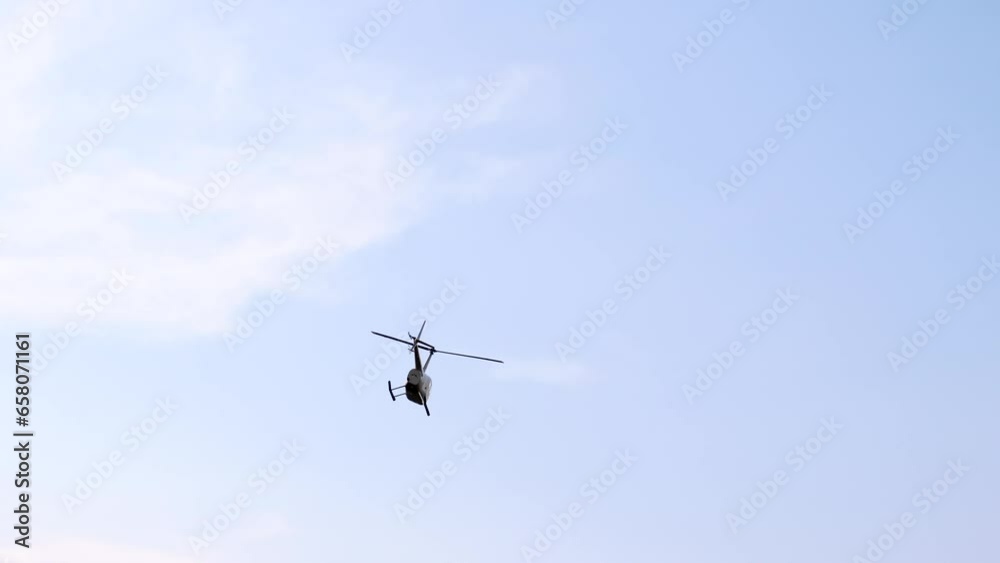 Closeup Of A Private Helicopter Fly On Blue Sky By Day Slow Motion Closeup Of A Private Helicopter Fly On Blue Sky By Day Slow Motion