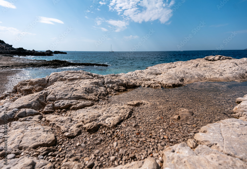 Sea landscape, blue turquoise water and foamy wave in a rocky bay. Sea landscape, blue turquoise water and foamy wave in a rocky bay.
