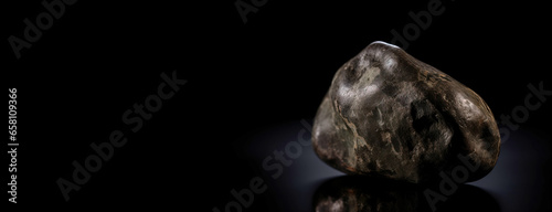 Musgravite is a rare precious natural geological stone on a black background in low key. AI generated.