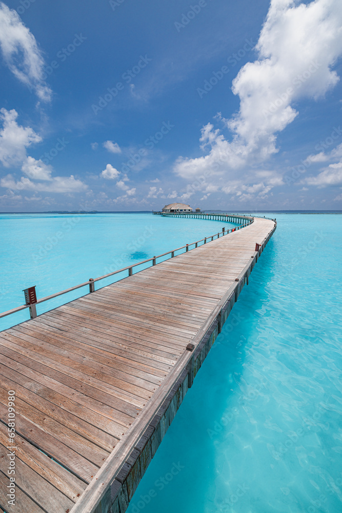 Panoramic landscape of Maldives beach. Tropical resort luxury water villa resort wooden pier. Popular travel destination background for summer holiday best vacation. Exotic sea bay sunny sky clouds