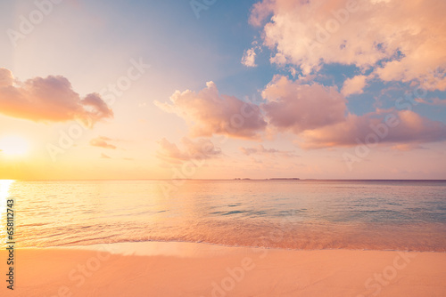 Closeup sea waves sand beach. Panoramic beach landscape. Inspire tropical coast seascape horizon. Stunning sunset sunlight colors, tranquil peaceful sky calm water. Happy positive vacation travel mood