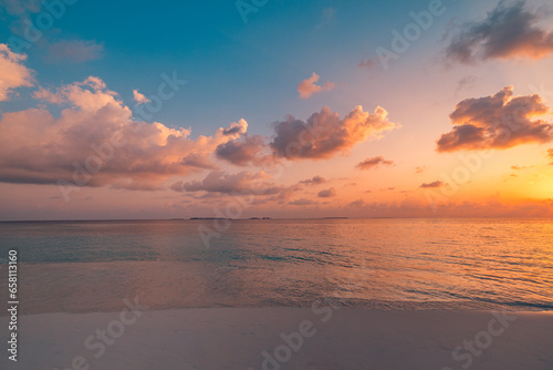 Fototapeta Naklejka Na Ścianę i Meble -  Closeup sea waves sand beach. Panoramic beach landscape. Inspire tropical coast seascape horizon. Stunning sunset sunlight colors, tranquil peaceful sky calm water. Happy positive vacation travel mood