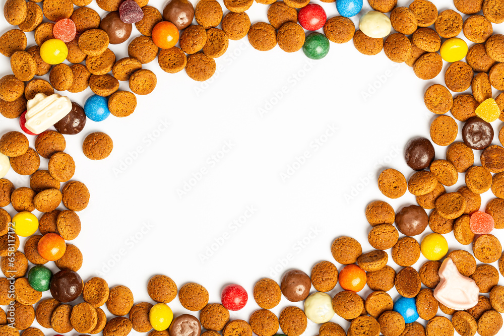 Concept for greeting card with traditional Dutch cookies kruidnoten for Saint Nicholas winter holiday called Sinterklaas in Netherlands, Belgium, Luxembourg. Top view background with copy space Concept for greeting card with traditional Dutch cookies kruidnoten for Saint Nicholas winter holiday called Sinterklaas in Netherlands, Belgium, Luxembourg. Top view background with copy space
