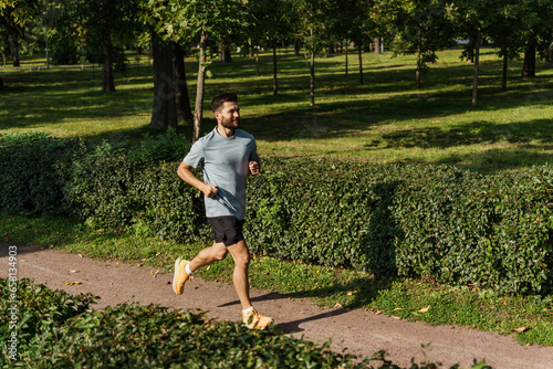 Warm-up running marathon preparation, athletic man and fitness. Interval training an athlete running actively outside. A runner doing weight loss exercises every day is a routine. © muse studio