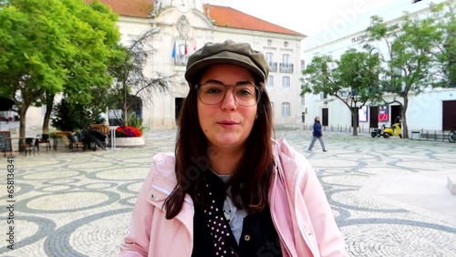 European woman explains Aveiro history from the City Hall, daytime photo