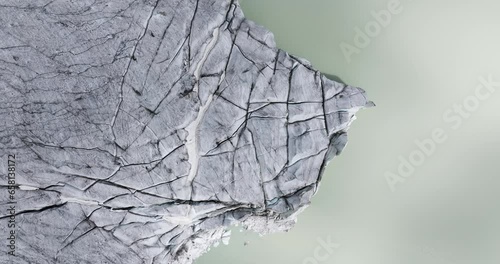 Fellaria glacier and lagoon, Valmalenco in Italy. Aerial top-down descending photo